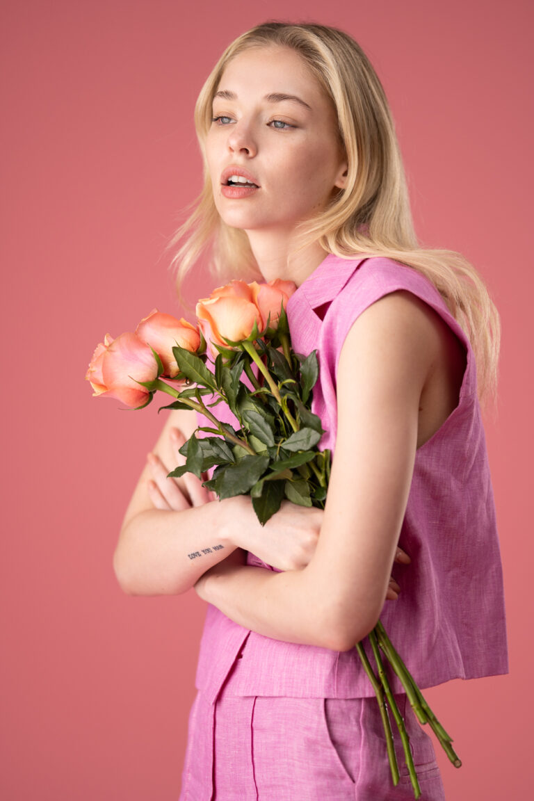 Model against a pink background